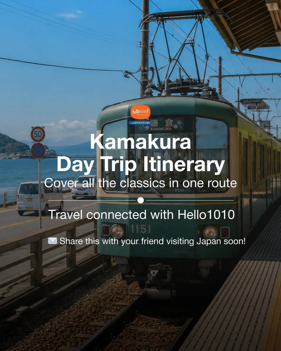 Enoden train waiting at a Kamakura station platform beside the coast road