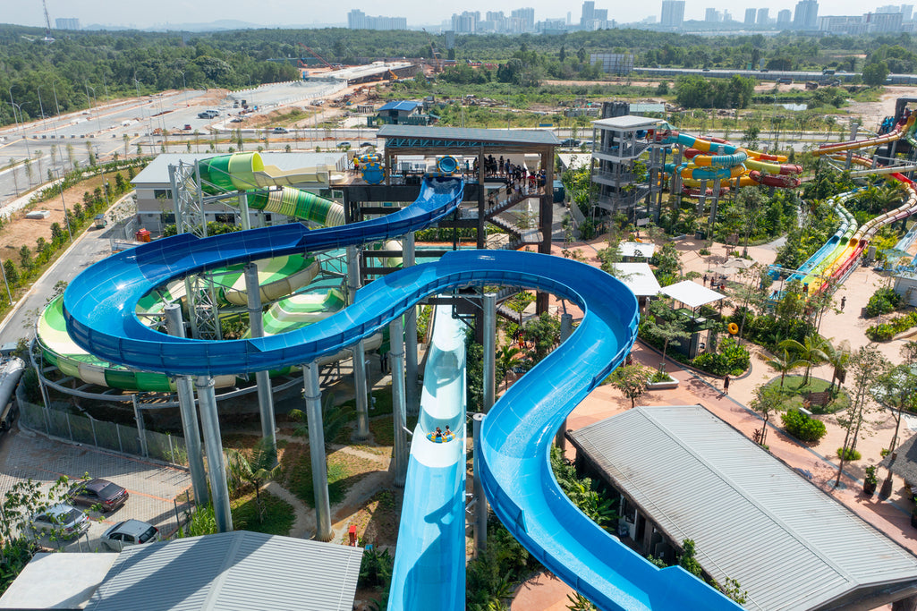 Aerial view of the blue flume slides curving through the park.