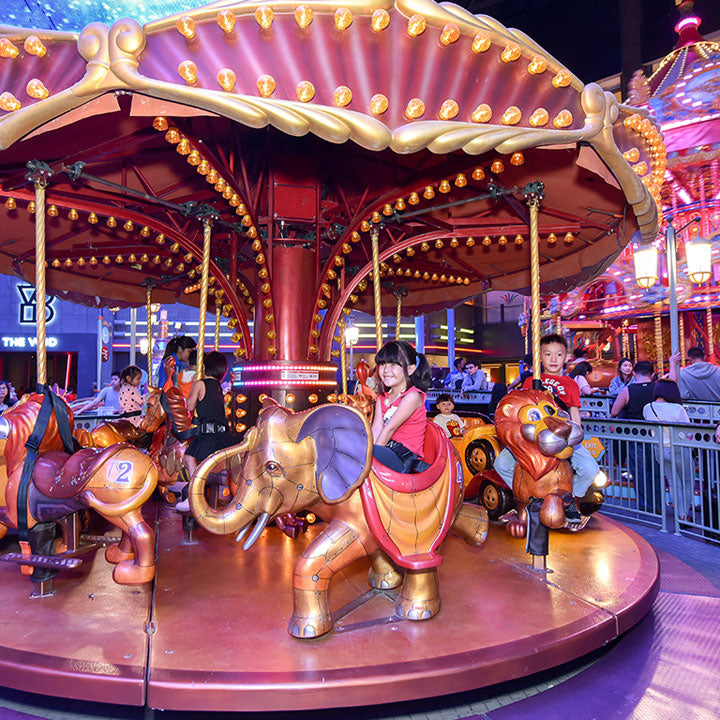 The indoor carousel with its painted elephant and horse mounts.