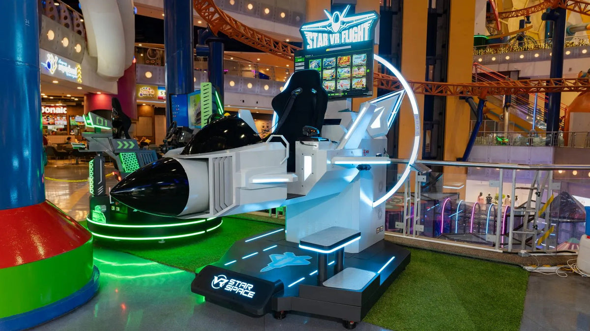 A Star Flight simulator pod with its safety rails, on the indoor park floor.
